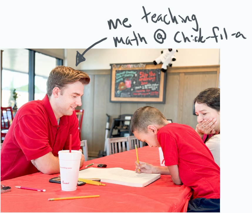 Tutor working one-on-one with a homeschool student at a table.